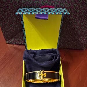Tort Burch Black and Gold Bracelet . New. Never worn.